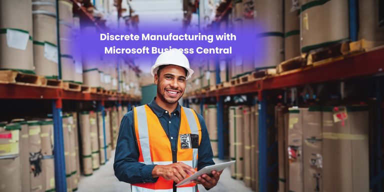 A smiling warehouse worker in a safety vest holds a tablet while standing in an industrial storage area filled with rolls of material.