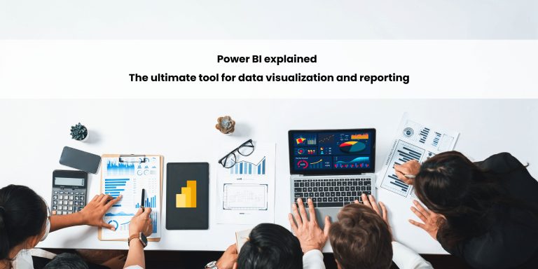 A group of people analyzing data with laptops and documents on a table, showcasing various charts and graphs.